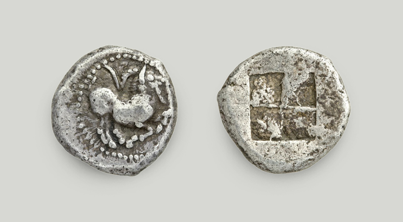 Left: kneeling caprine on the obverse; right: incuse square on the reverse.  Silver drachma, Paros