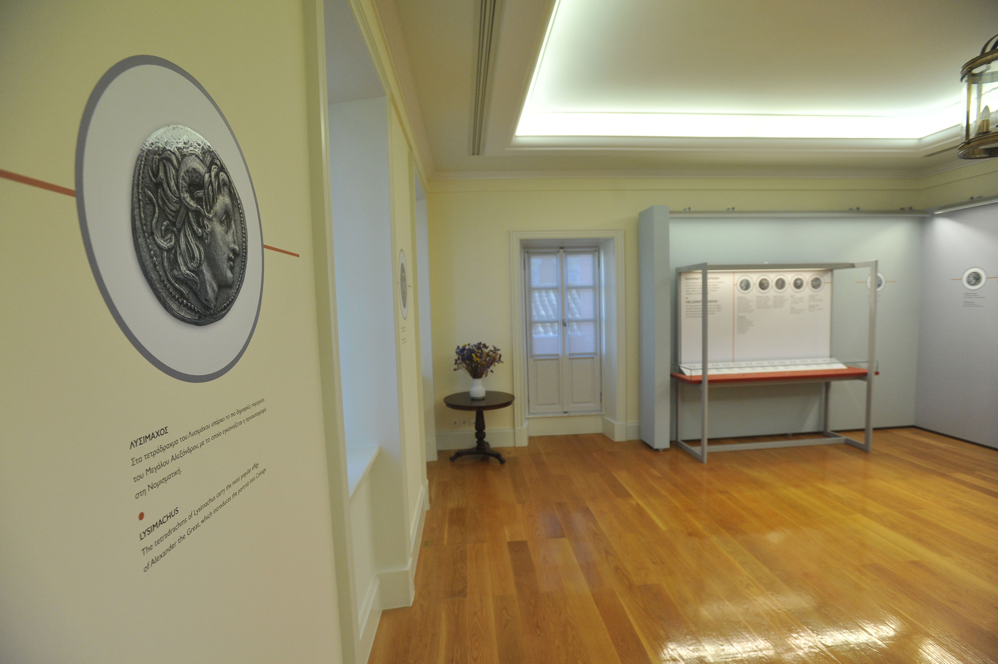 The exhibition area with exhibits in illuminated cases and relevant useful material.  Exhibits “Coins in the Ancient Greek World”