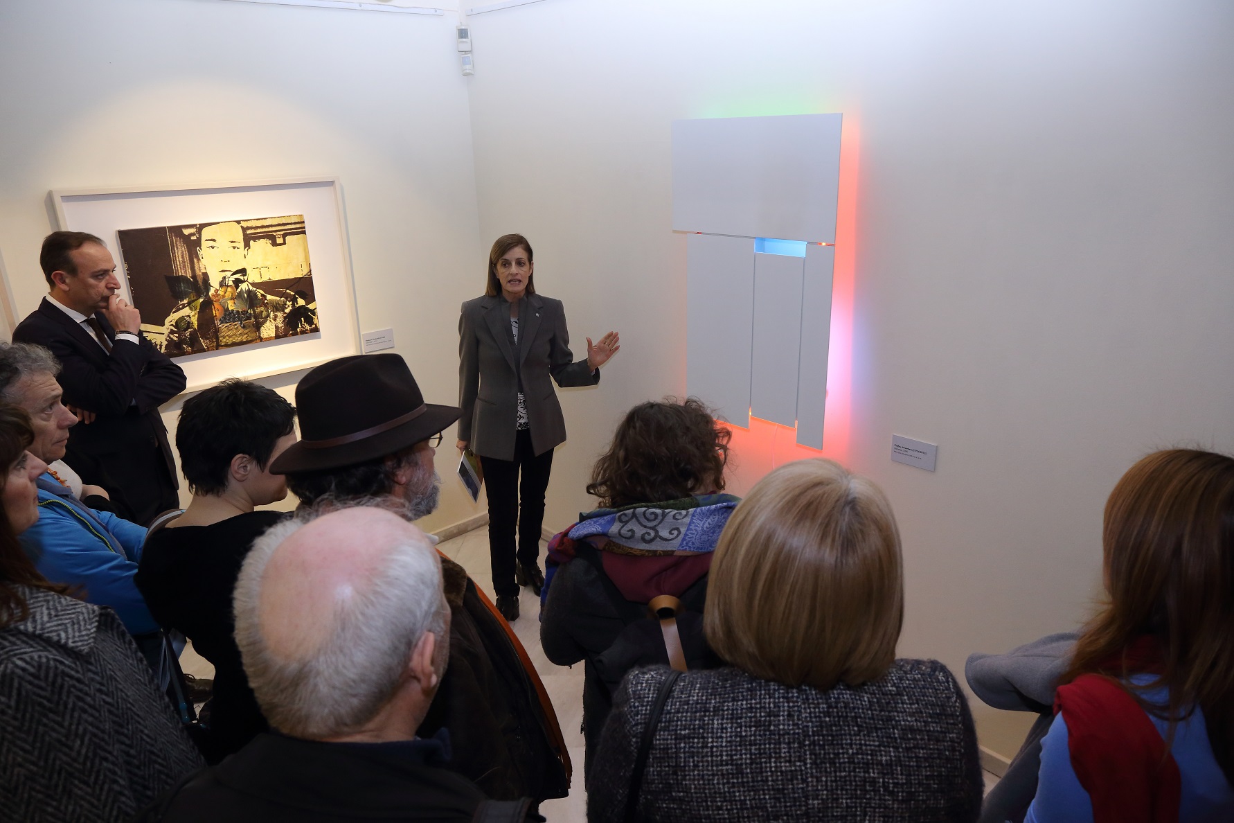 Tour guide and visitors in front of pieces in the exhibition.  Exhibition “The Alpha Bank Collection. Greek Art from 1950 until Today” – Ioannina