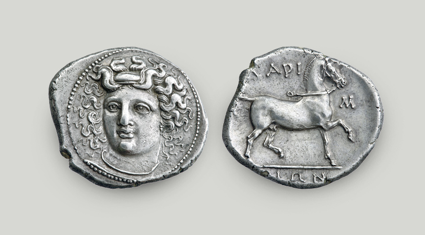 Two sides of Larissa silver didrachm. On the obverse head of nymph Larissa, on the reverse horse and the legend “of the Larisseans”.  Two sides of Larissa silver didrachm