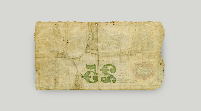 Η οπίσθια όψη του τραπεζογραμματίου 25 δραχμών του 1868, η οποία είναι λευκή. Φαίνεται μόνο η αριθμητική του αξία, ανάποδα.  Οπίσθια όψη τραπεζογραμματίου 25 δραχμών