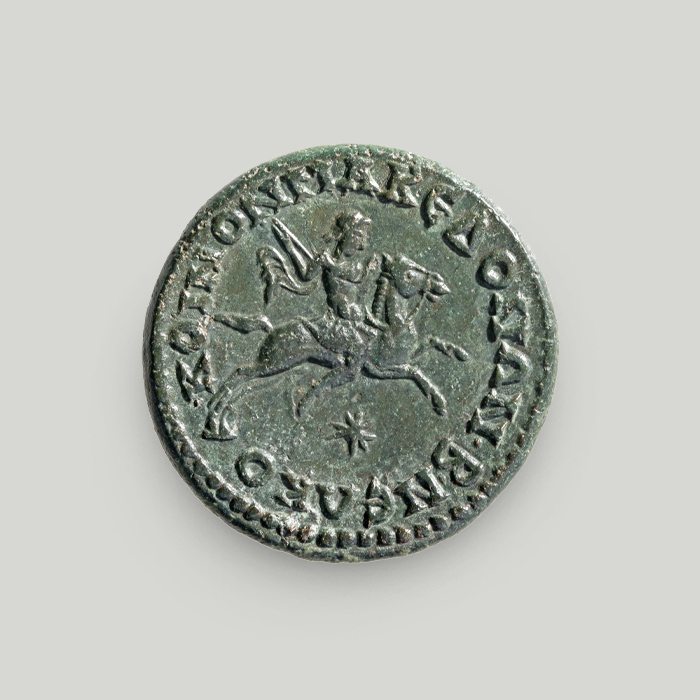 Reverse of bronze coin of Gordian III depicting Alexander on Bucephalus; the legend reads League of the Macedonians.  Reverse of bronze coin issued under Gordian III